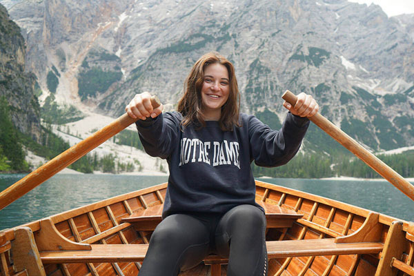 Emma Ackerley canoeing in Lago di Braies in the Italian Dolomites.