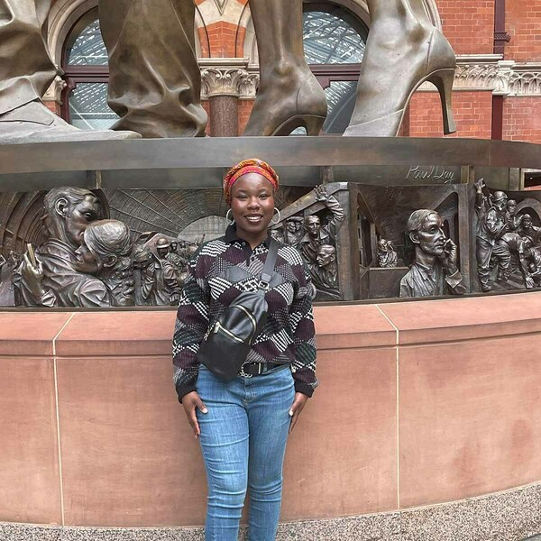 Ida in front of the Meeting Place statue in St. Pancras